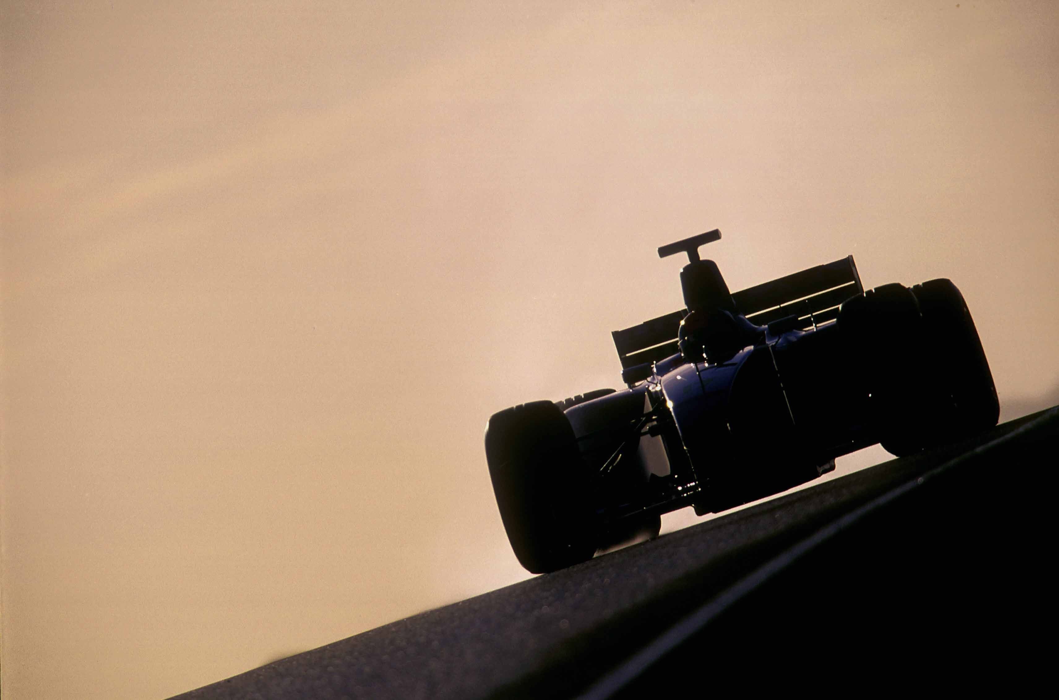Red Bull Racing RB22 2026 Formula 1 car, dark navy blue livery with red and yellow Oracle branding, low angle dramatic studio lighting