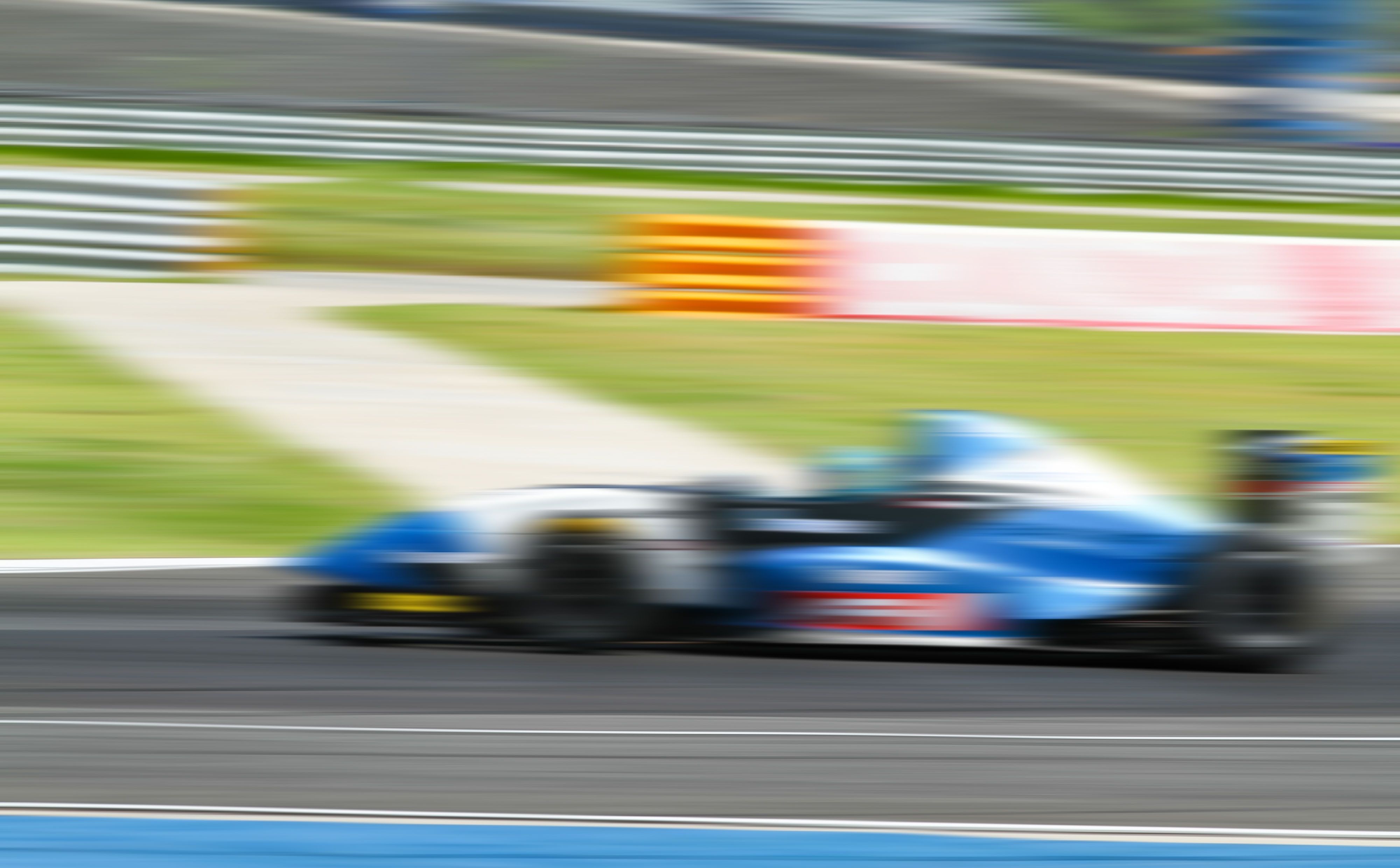 BWT Alpine A526 2026 Formula 1 car, blue and pink BWT livery, low angle dramatic studio lighting